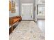 Welcoming foyer with wooden floors and a decorative rug at 135 Ardsley Run, Canton, GA 30115