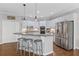 Modern kitchen with an island, stainless steel appliances, and ample counter space at 135 Ardsley Run, Canton, GA 30115
