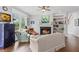 Bright living room with fireplace, built-in shelving, and large window overlooking the backyard at 135 Ardsley Run, Canton, GA 30115
