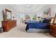 Spacious main bedroom suite with a sitting area and lots of natural light from a multitude of windows at 135 Ardsley Run, Canton, GA 30115