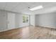 Finished basement area with wood-look flooring, and natural light from a window at 176 Villa Rosa Rd, Temple, GA 30179