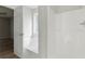 Bright bathroom features a tub and shower combination with natural light from a window at 176 Villa Rosa Rd, Temple, GA 30179