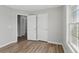 Bedroom with two closets and a window, showcasing ample storage space at 176 Villa Rosa Rd, Temple, GA 30179