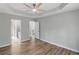 This bedroom features wood floors and two doors leading to other rooms at 176 Villa Rosa Rd, Temple, GA 30179