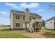 Rear exterior of home with a deck and stairs leading to the backyard at 176 Villa Rosa Rd, Temple, GA 30179