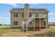 Rear exterior of house with deck and stairs leading to the backyard at 176 Villa Rosa Rd, Temple, GA 30179