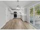 Open-concept kitchen features white cabinets, stainless steel appliances, and a view of the deck at 176 Villa Rosa Rd, Temple, GA 30179