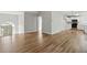Spacious living room with hardwood floors leading to the kitchen and a vaulted ceiling at 176 Villa Rosa Rd, Temple, GA 30179