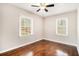 Cozy bedroom featuring hardwood floors and two windows for ample natural light at 2168 Doris Dr, Decatur, GA 30034