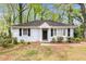 Charming single-story home with a brick facade, black shutters, and well-maintained landscaping at 2168 Doris Dr, Decatur, GA 30034