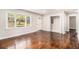 Spacious living room with hardwood floors, natural light, and convenient laundry closet at 2168 Doris Dr, Decatur, GA 30034