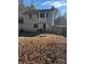 View of the house from the backyard of the property with a fence at 3833 Brookstone Way, Ellenwood, GA 30294