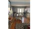 A dining area offering wood floors and seamlessly connected to a kitchen bar counter at 3833 Brookstone Way, Ellenwood, GA 30294