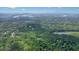 Aerial view of a lush, green landscape with bodies of water visible at 1514 Maplewood Ct, Woodstock, GA 30189