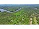 Aerial view showcasing a home amidst a lush, tree-filled landscape at 1514 Maplewood Ct, Woodstock, GA 30189