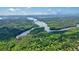 Lush forest with a view of a lake in the distance at 1514 Maplewood Ct, Woodstock, GA 30189