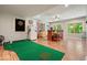 Finished basement with putting green, dart board, and bar area, great for entertaining at 1514 Maplewood Ct, Woodstock, GA 30189