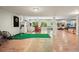 Finished basement boasts golf practice area, bar, and a large recreational space at 1514 Maplewood Ct, Woodstock, GA 30189