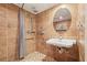Bathroom featuring tiled walls, a accessible sink and shower with grab bars at 1514 Maplewood Ct, Woodstock, GA 30189