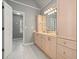 Bathroom featuring double sinks, vanity cabinets, and neutral paint at 1514 Maplewood Ct, Woodstock, GA 30189