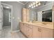 Bathroom featuring double sinks, vanity cabinets, and neutral paint at 1514 Maplewood Ct, Woodstock, GA 30189