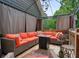 Inviting covered patio features a seating area with comfortable cushioned furniture at 1514 Maplewood Ct, Woodstock, GA 30189