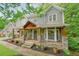 Inviting front porch with stone pillars, rocking chairs, and a warm, welcoming atmosphere at 1514 Maplewood Ct, Woodstock, GA 30189