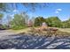 Entrance to the golf club surrounded by lush landscaping and mature trees at 1514 Maplewood Ct, Woodstock, GA 30189