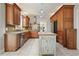 Spacious kitchen with granite counters, stainless steel appliances, lots of wooden cabinets, and a unique island at 1514 Maplewood Ct, Woodstock, GA 30189