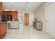 Bright kitchen featuring custom cabinets, a decorative island, and new appliances with natural light and a wood accent wall at 1514 Maplewood Ct, Woodstock, GA 30189