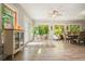 Open-concept living and dining space with wood-look flooring, abundant natural light, and neutral décor at 1514 Maplewood Ct, Woodstock, GA 30189