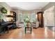 Cozy living room featuring hardwood floors, comfortable seating, and natural light at 1514 Maplewood Ct, Woodstock, GA 30189