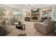 Inviting living room with stone fireplace, comfortable furnishings, and natural light at 1514 Maplewood Ct, Woodstock, GA 30189