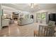 Spacious living room featuring a stone fireplace, wood floors, and comfortable seating at 1514 Maplewood Ct, Woodstock, GA 30189