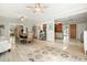 Open-concept living space with dining area, kitchen, and ample natural light, ideal for entertaining and Gathering living at 1514 Maplewood Ct, Woodstock, GA 30189