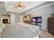 Comfortable carpeted main bedroom with trey ceiling and gray walls at 1514 Maplewood Ct, Woodstock, GA 30189