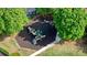 Aerial view of a community playground with slides, swings, and climbing structures on a mulch surface at 1514 Maplewood Ct, Woodstock, GA 30189