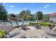 Enjoy the community pool with lounge chairs and patio seating at 1514 Maplewood Ct, Woodstock, GA 30189