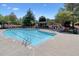 Community swimming pool featuring a lap area and a cozy covered pergola with lounge chairs at 1514 Maplewood Ct, Woodstock, GA 30189