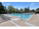Community pool offers a refreshing retreat with lounge chairs and a nearby covered seating area at 1514 Maplewood Ct, Woodstock, GA 30189