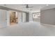 Large bedroom with modern ceiling fan, light grey walls, patterned carpet and a bathroom attached at 2444 Ballantrae Cir, Cumming, GA 30041