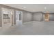 Spacious bedroom with neutral walls, stylish carpet, and views to the bathroom and another room at 2444 Ballantrae Cir, Cumming, GA 30041