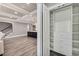 Walk-in closet with custom built-ins and adjacent views of an open floor plan at 2444 Ballantrae Cir, Cumming, GA 30041