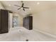Walk-in closet featuring a ceiling fan, neutral colors, and storage units at 2444 Ballantrae Cir, Cumming, GA 30041