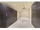 Walk in closet with ample storage featuring large storage units, neutral colors and a ceiling fan at 2444 Ballantrae Cir, Cumming, GA 30041