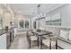Inviting dining area with a comfortable built-in bench and modern chandelier at 2444 Ballantrae Cir, Cumming, GA 30041