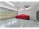 Spacious two-car garage with epoxy flooring, storage, and an abundance of overhead lighting at 2444 Ballantrae Cir, Cumming, GA 30041