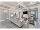 Elegant living room with coffered ceiling, fireplace, and sophisticated decor at 2444 Ballantrae Cir, Cumming, GA 30041