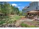 Spacious backyard featuring a lush lawn and patio area for outdoor entertaining at 35 Kestrel Circle, Covington, GA 30014