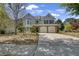 Charming two-story home featuring a stone facade, two-car garage, and well-maintained landscaping at 35 Kestrel Circle, Covington, GA 30014